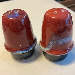 Very sturdy salt and pepper shakers. Not sure who they are by. There is a sig